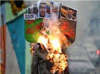 تصاوير «ترامپ» در ونزوئلا به آتش کشيده شد